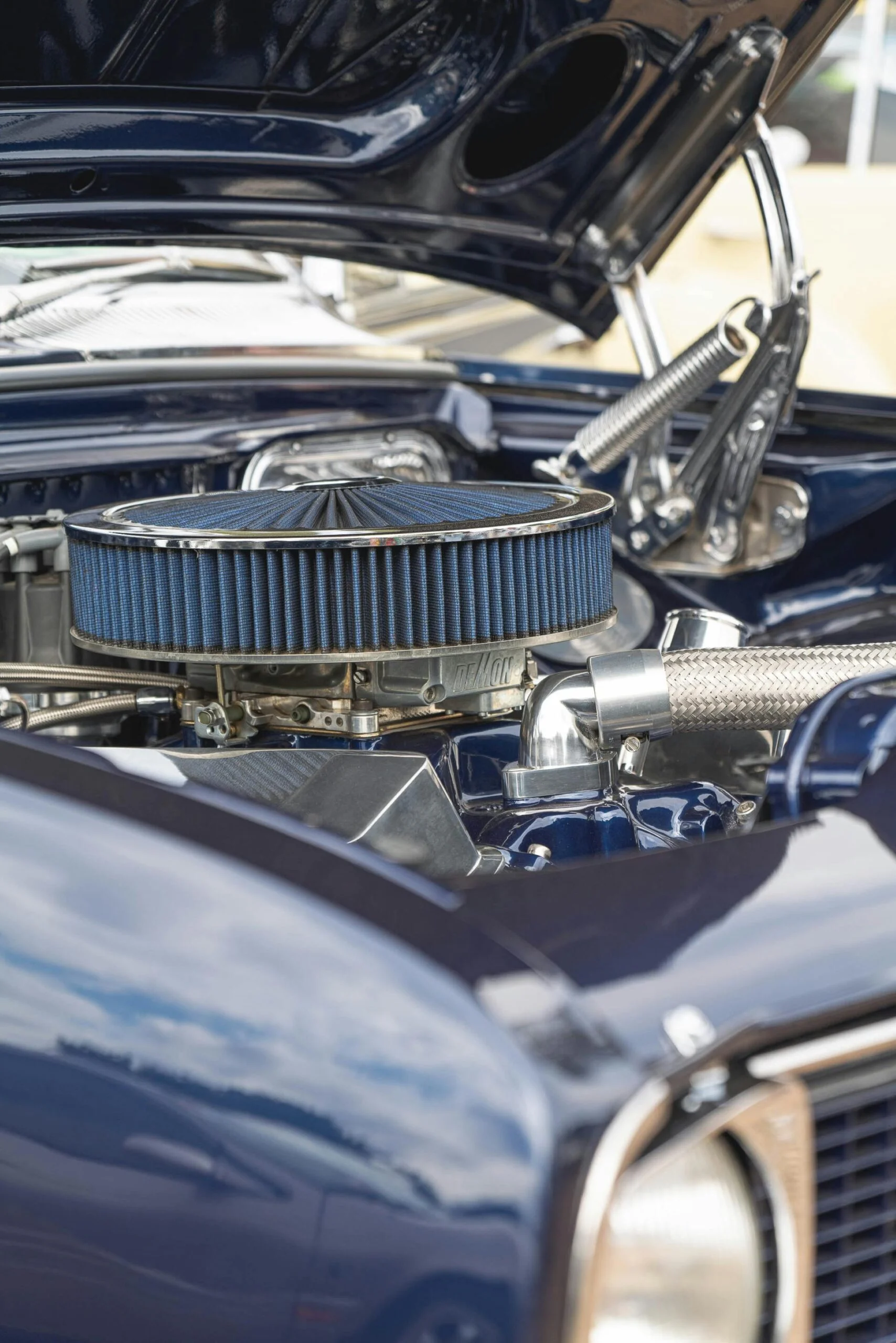 Close-up view of a vintage car engine showcasing mechanical details and design.